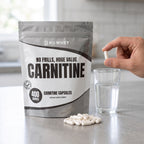 NoWhey Carnitine 400 Capsules - capsules and a glass of water on a kitchen counter
